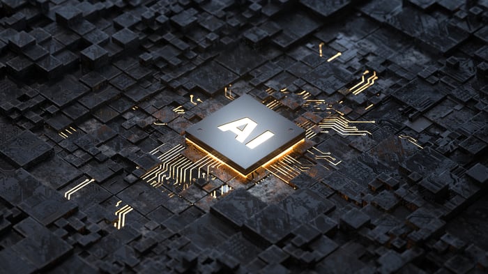 A circuit board with a chip in the center with the letters AI printed on it.