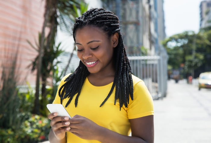 A person looking at a phone.