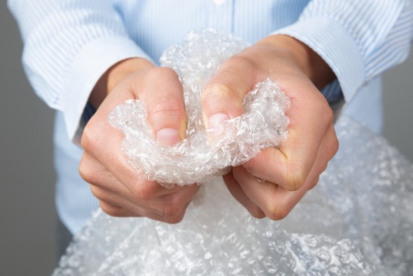 A person snapping bubble wrap.