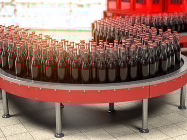 bottles of soda moving on a conveyor belt