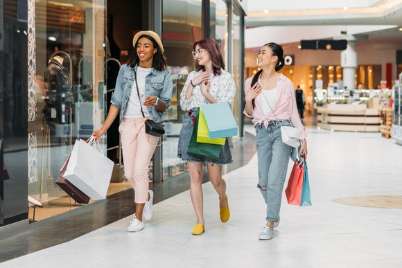 Happy people shopping in a mall.