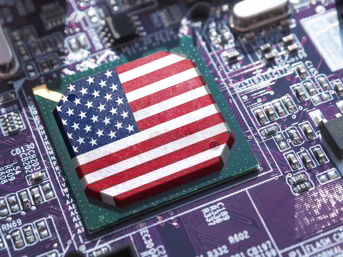 An American flag on a chip on a circuit board.