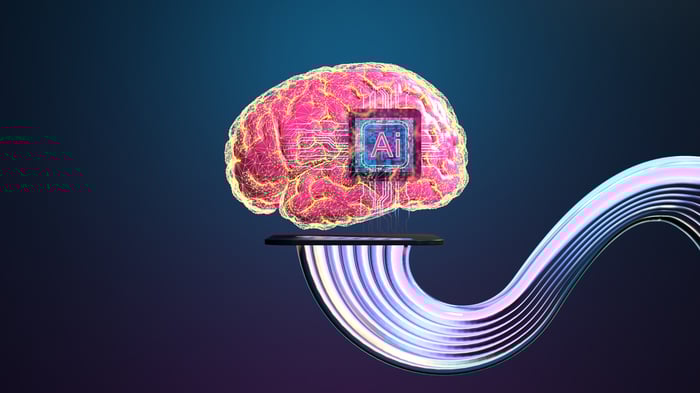A brain with a chip labeled AI inside it and cables running from the bottom of it.
