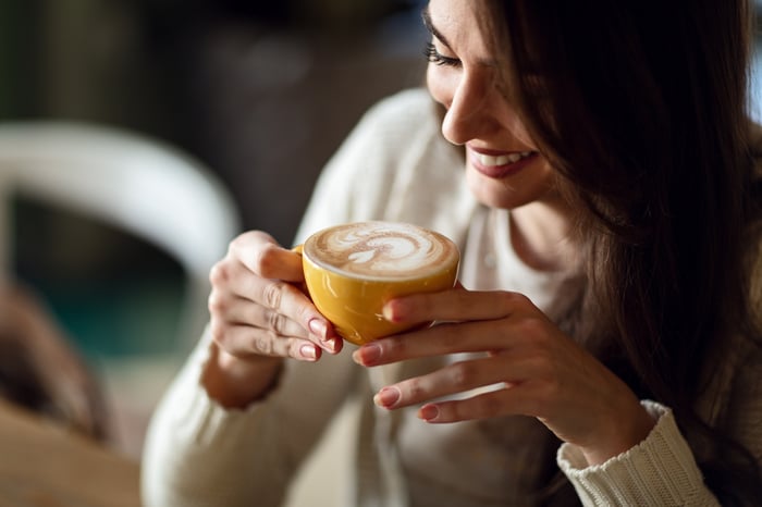 Person drinking coffee.