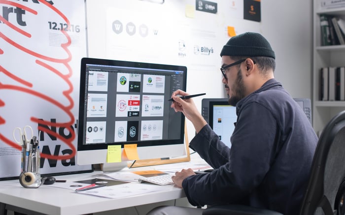 A man works on a computer.
