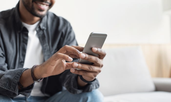Man using mobile phone.