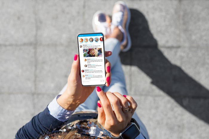 Social media scrolling on smartphone.