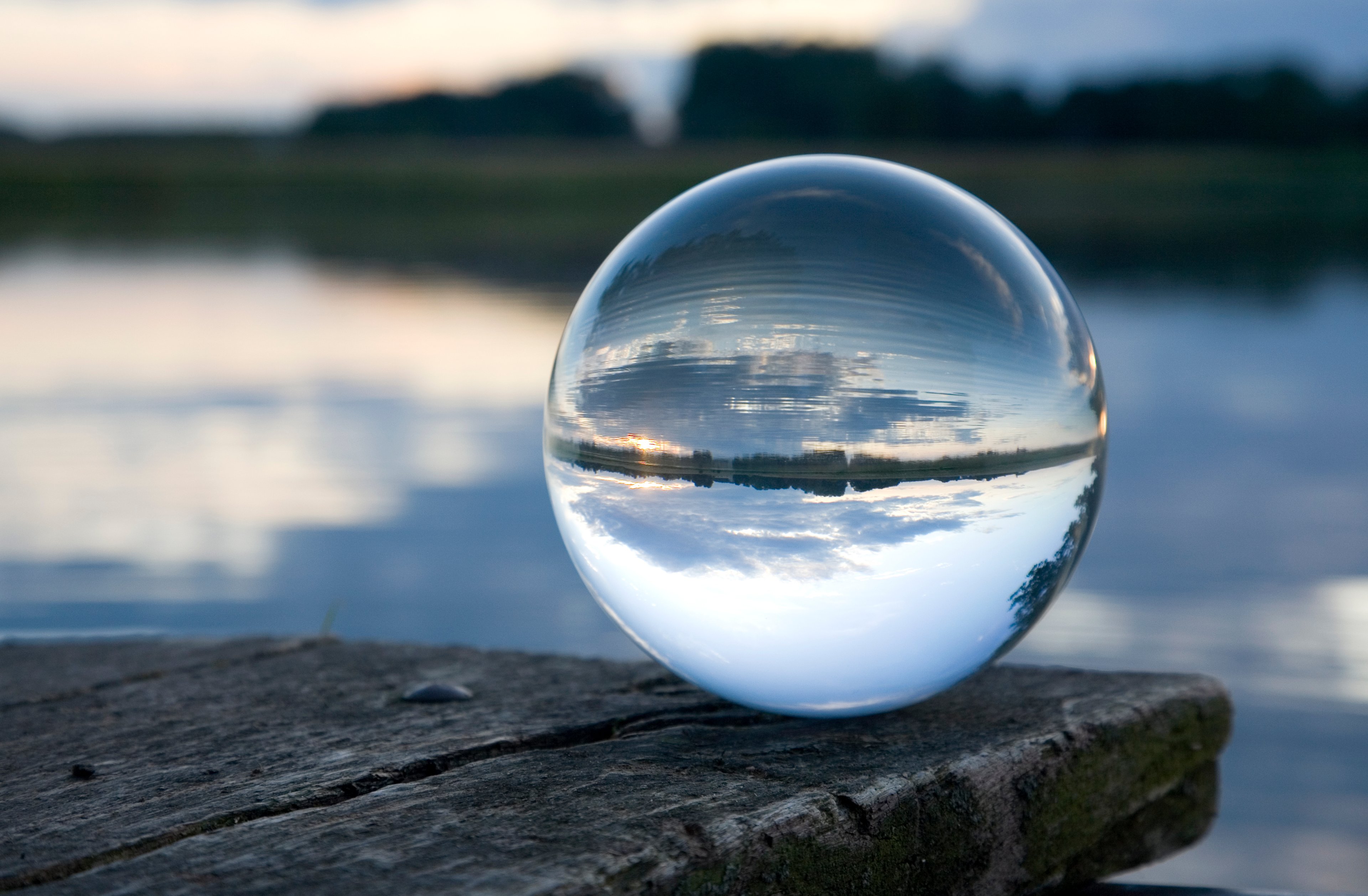 A crystal ball resting on a table.