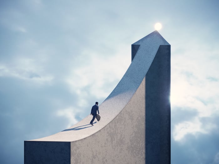 A person walking on a chart arrow moving up.