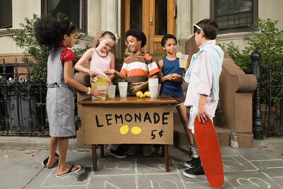 Children with a lemonade stand.