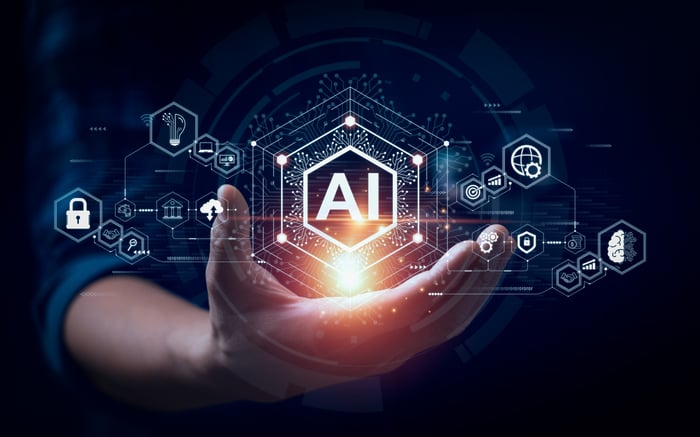 AI and digital images appearing above an outstretched hand.