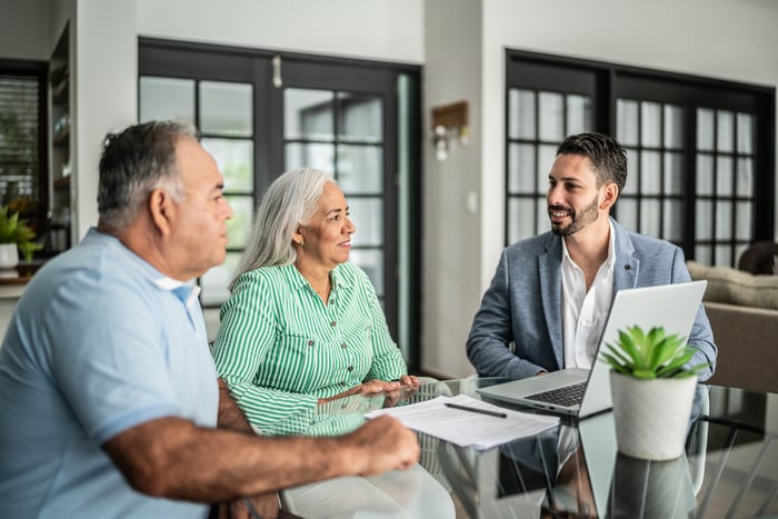 Couple meeting with financial advisor.