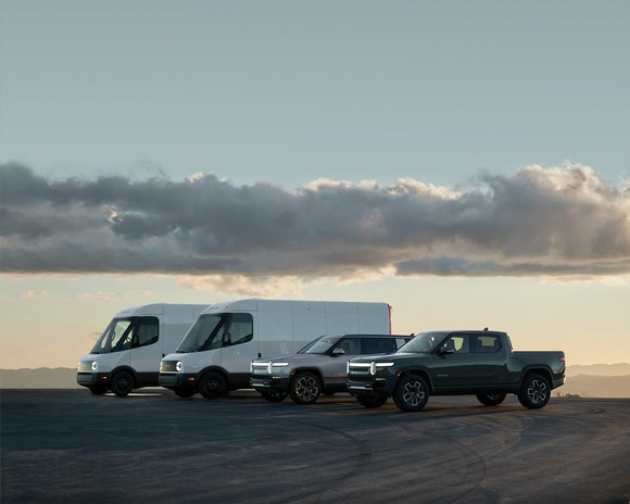 Image shows Rivian vehicles, including delivery vans, SUV, and truck.