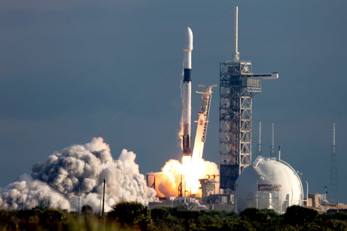 A rocket launch off of a launchpad.