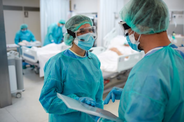 Physicians in an operating room.