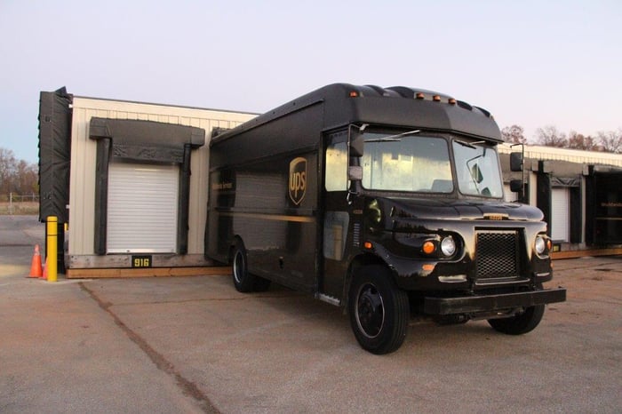 A UPS truck at a loading station.