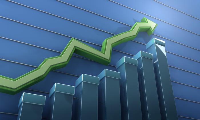 Green arrow marches higher over a bar chart.