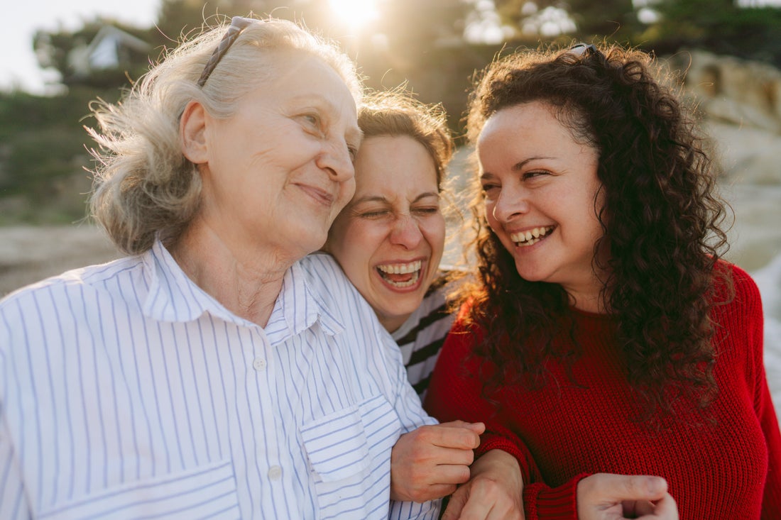 Three people laughing.
