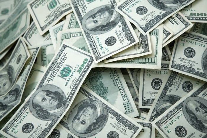A loose collection of hundred dollar bills.