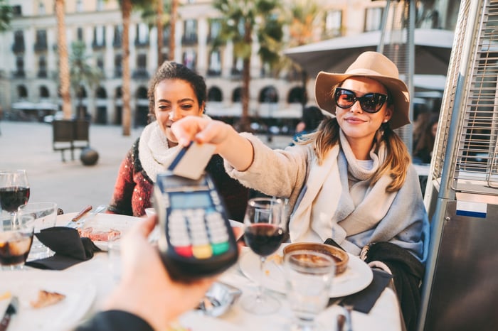 A person paying at a restaurant.