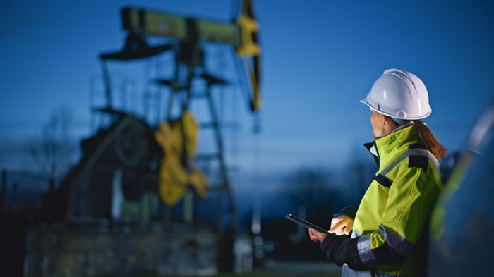 Person working in oil field.