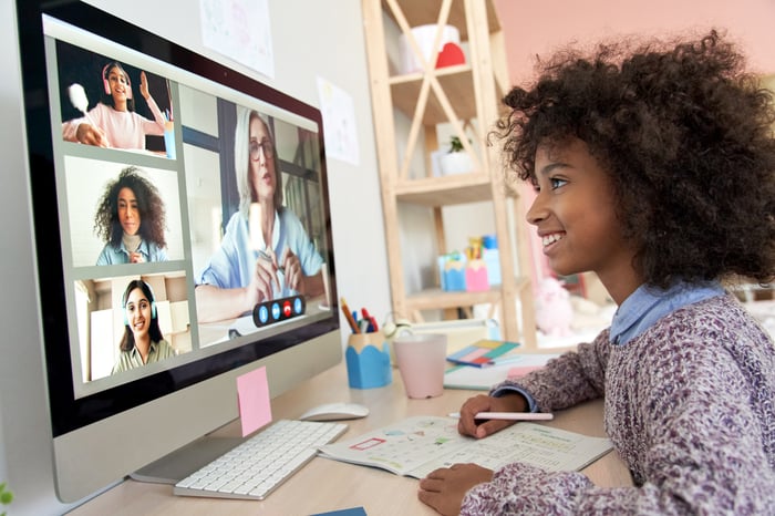Worker participates in an online meeting.