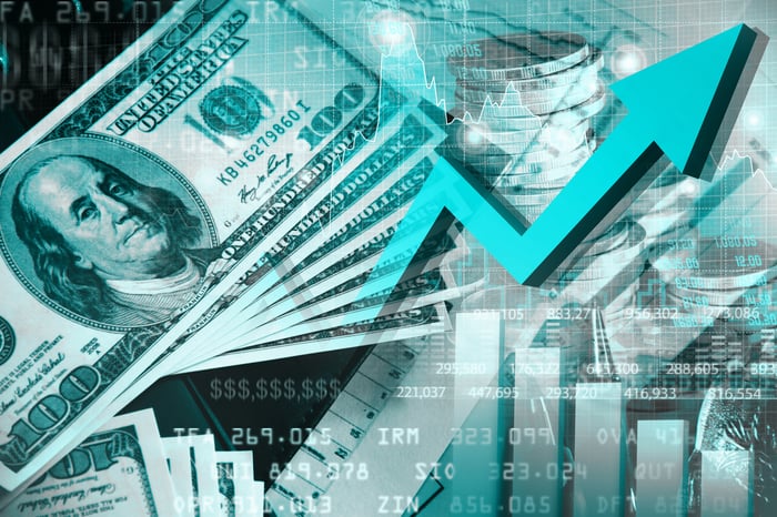 An upward arrow and money.