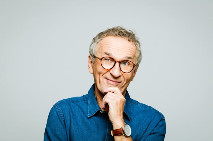 Person with hand on chin while thinking.