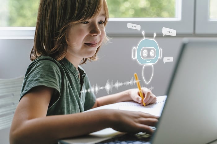 A child using a laptop.
