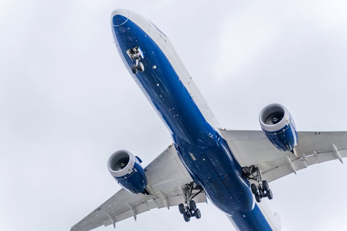 The underside of an aircraft in the sky.