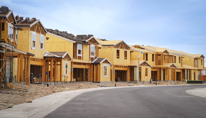 A row of houses in the midst of being built.