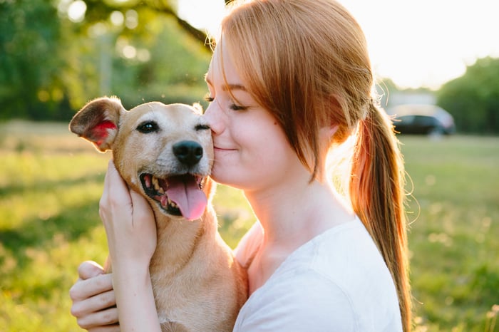 Person hugging their dog.