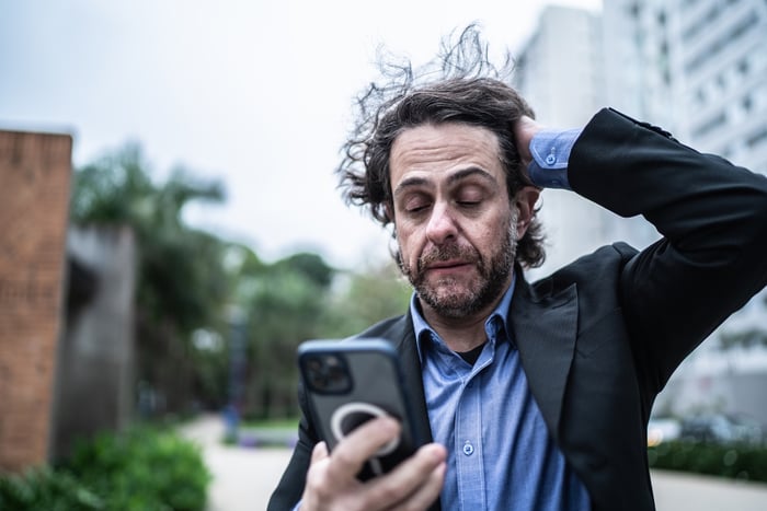 A person looking at a phone.