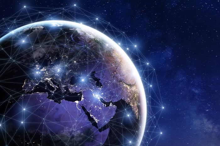 Planet earth with network of interconnected lights.
