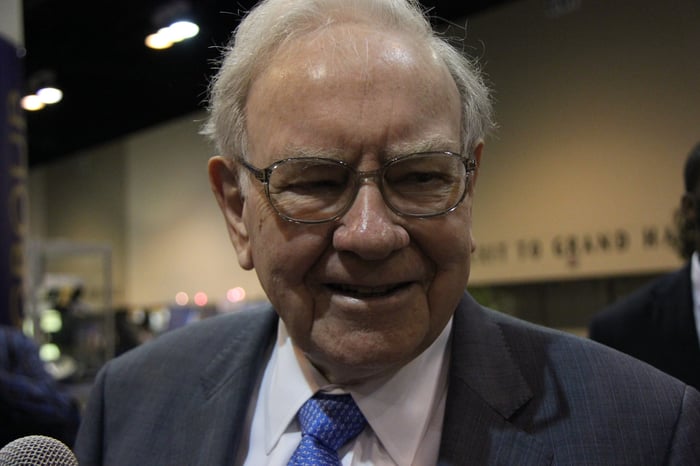 A close up of Warren Buffett looking and smiling. 