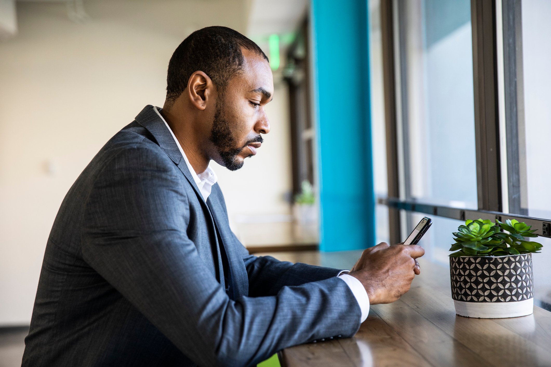 Investor checking stock prices on a smartphone.