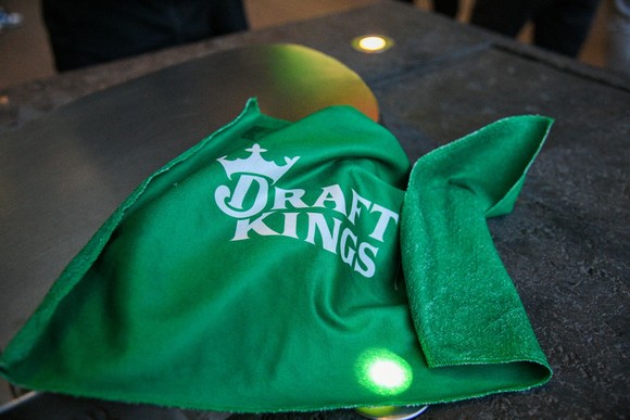 A towel with "DraftKings" written on it.