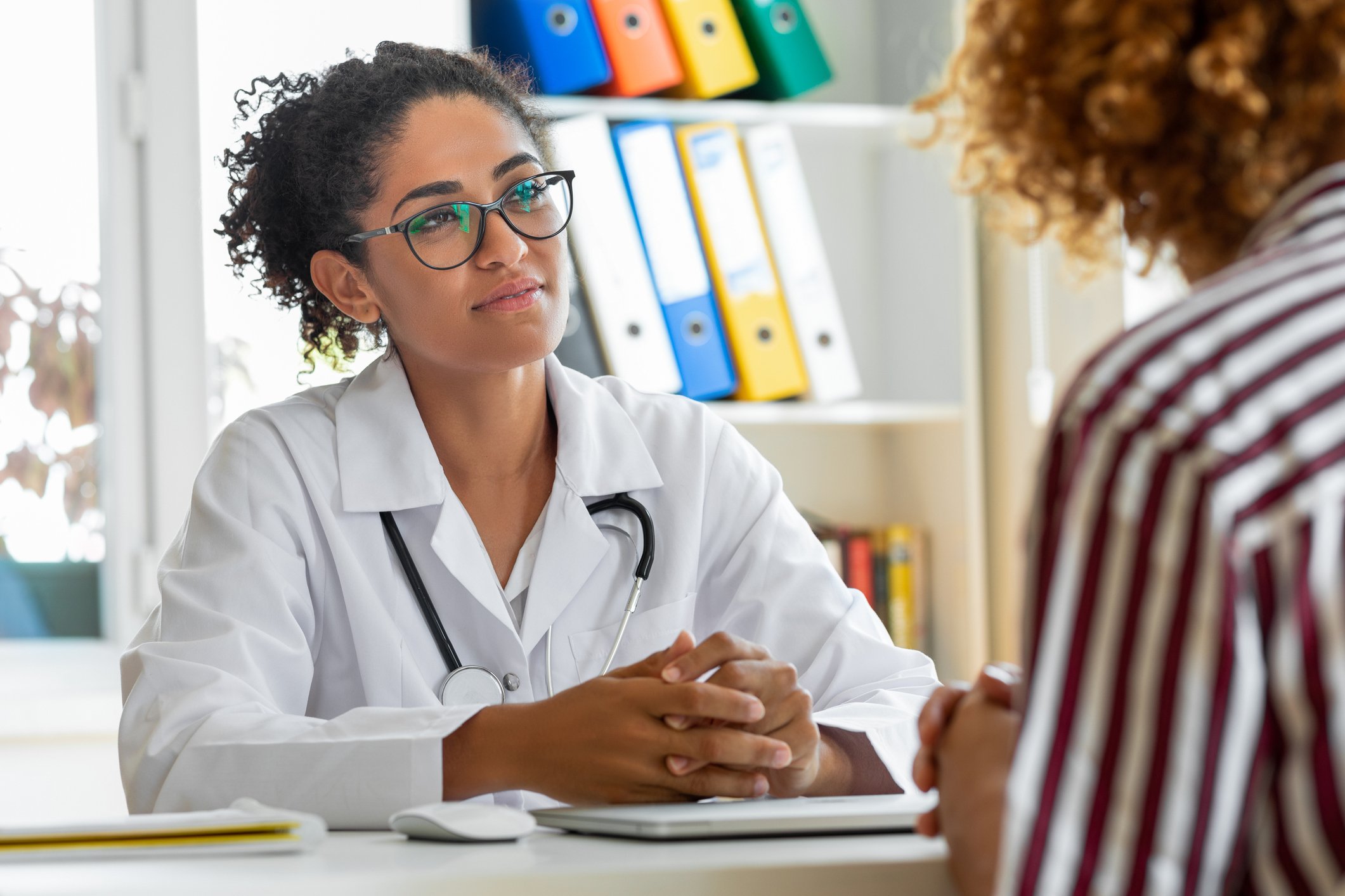 Physician talking to patient.