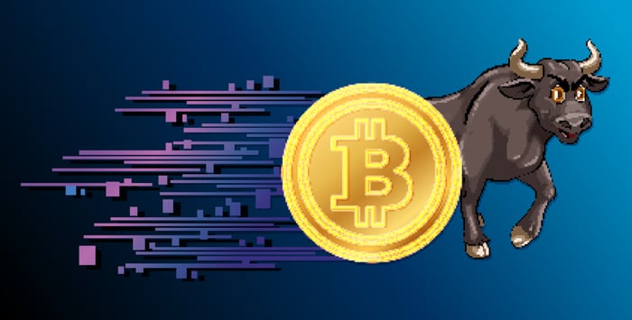 An illustration of a bull and the Bitcoin symbol. 