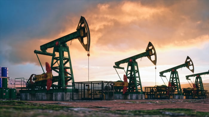 A set of oil rigs in a field.