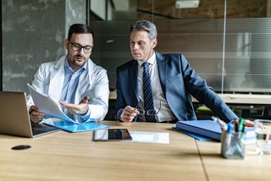 Businessperson and doctor talking.