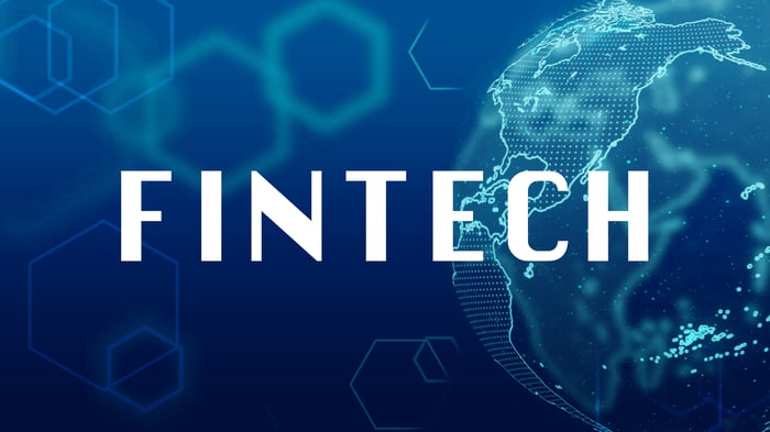 The word Fintech against a digital background.