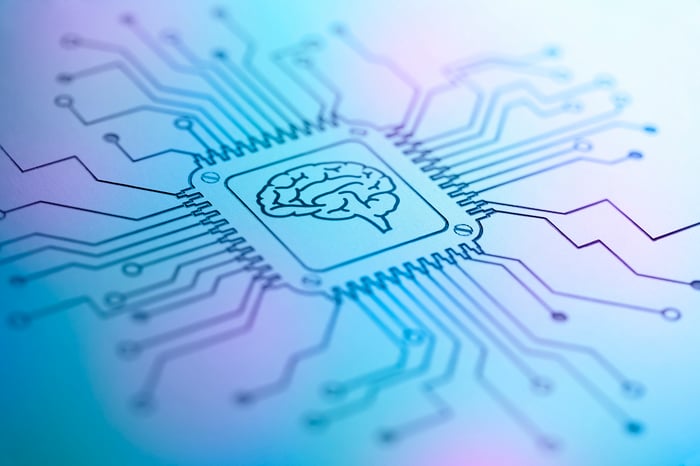 An artificial intelligence chip etched into an iridescent background.
