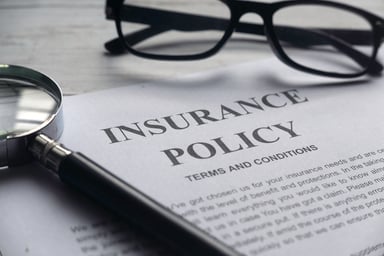 Getty - insurance policy and glasses (1)