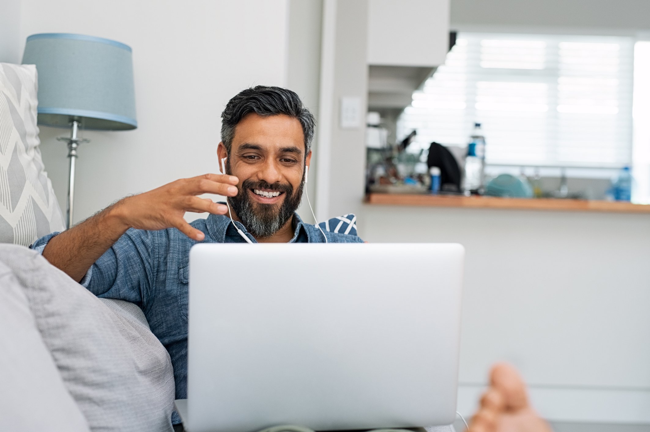 a person uses a laptop at home
