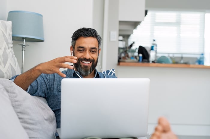 A person uses a laptop at home.
