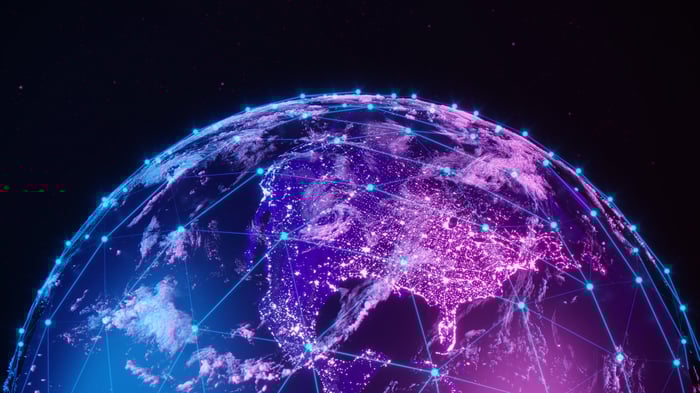 Digital illustration of Earth at night with glowing network lines and connected points across continents.