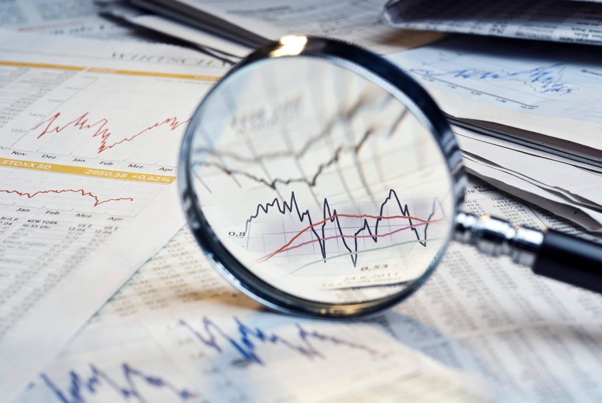 GettyImages-magnifying glass stock charts