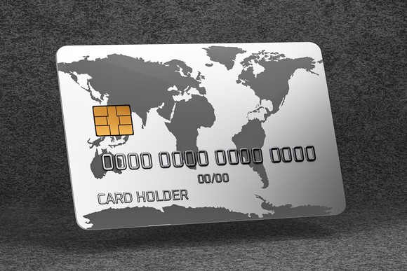 A credit card on a gray background. 
