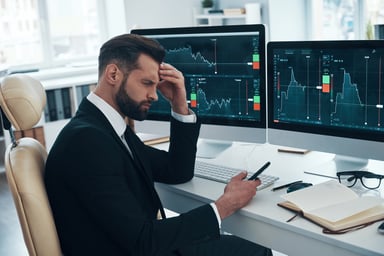 concerned investor at trading desk